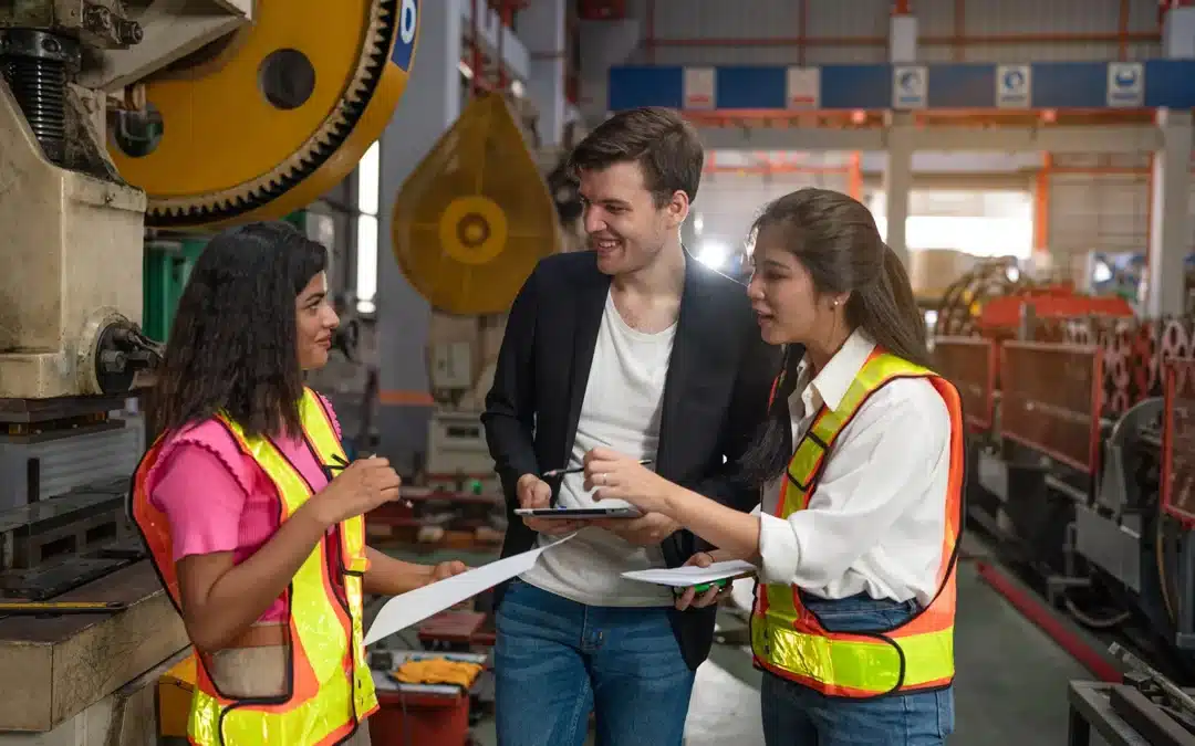 Ondernemer en medewerkers werken samen met digitale planning tools, moderne aanpak van goed werkgeverschap